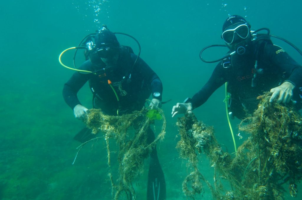 Divers ghost nets